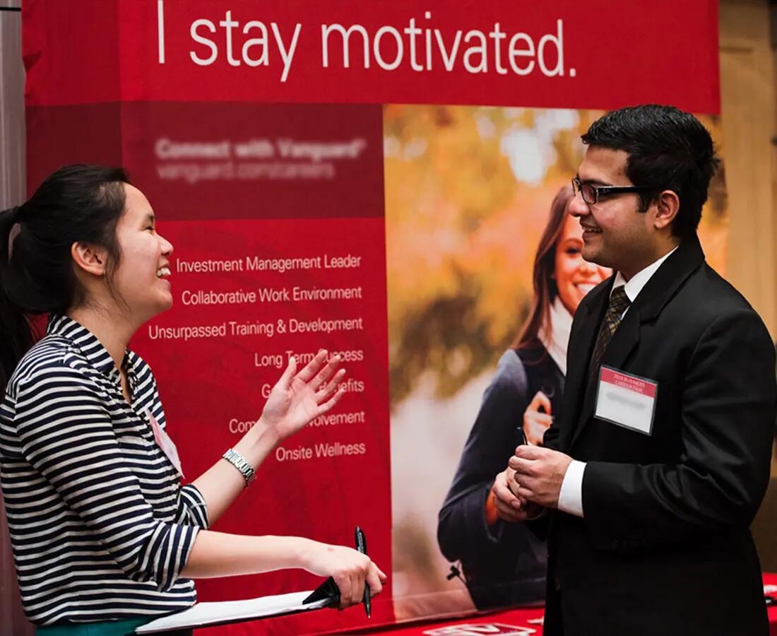 Student talking with recruiter