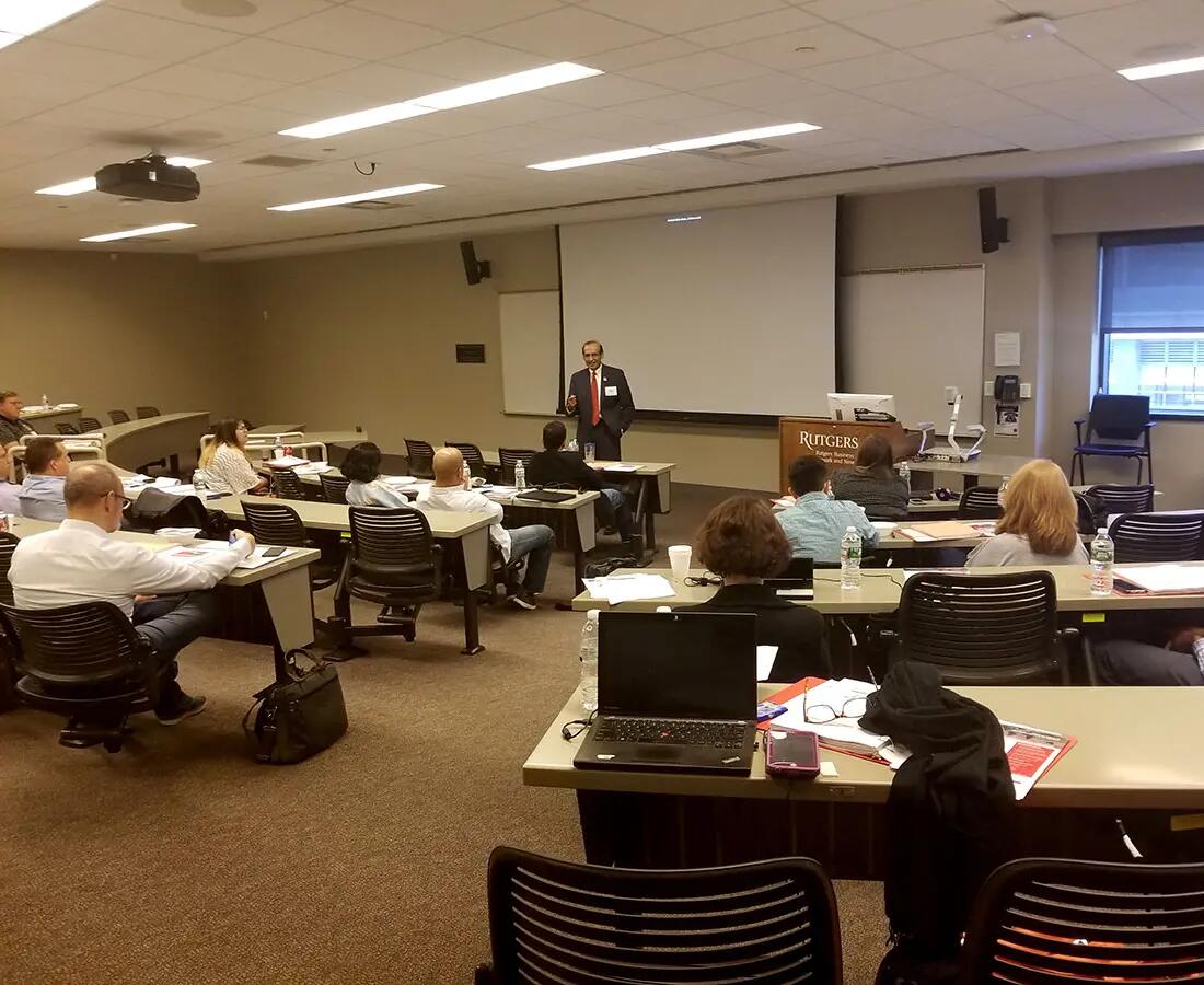 Professor Alok Baveja in class with students of the program