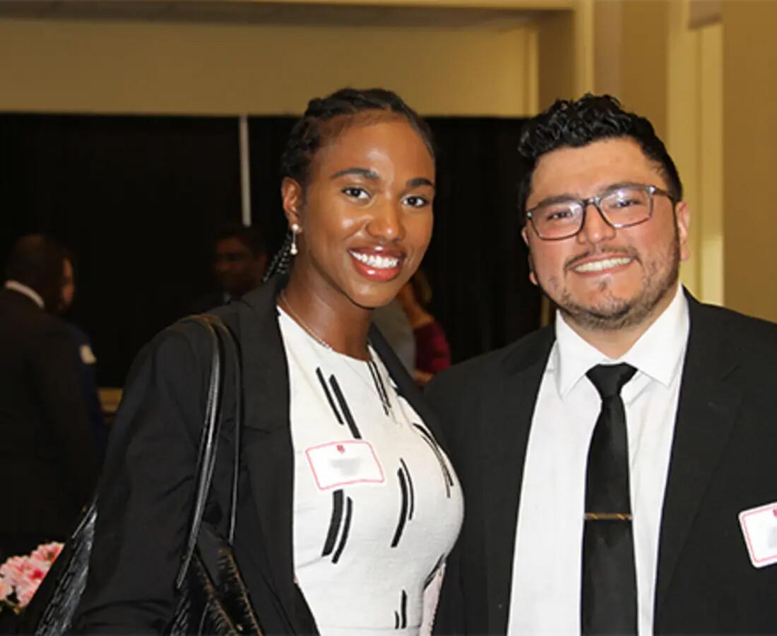 female and male mba students posing for picture