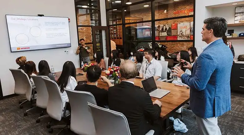 Tunghai University students listen to a presentation by Jeffrey Hermann, CEO of Hermann Services, Inc.  