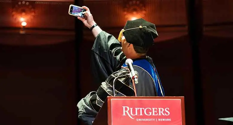 Vice Dean of Academic Programs Shen Yeniyurt taking a selfie photograph as the convocation ceremony opened.
