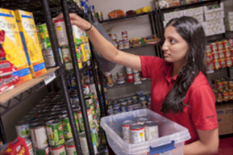 student working in food pantry