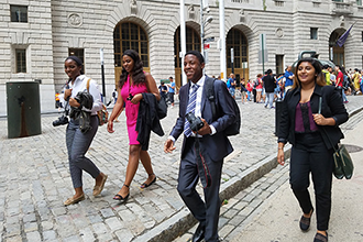 students on a trip on wall street
